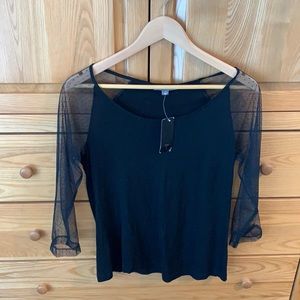 Black shirt with sheer arms and polka dots.